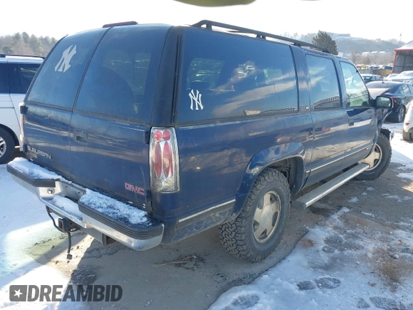 1998 GMC Suburban z VIN 1GKFK16R7WJ700525, wystawiony jako IAAI lot #41305248 z przebiegiem 205 300 mil mil oraz . Historia ofert i sprzedaży dostępna na DreamBid. Obrazek 4.