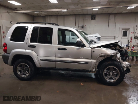 2004 Jeep Liberty Sport with VIN 1J4GL48K44W182897, listed as a IAAI auction lot 40768956 with 241,550 mi miles and . Bid and sale history available at DreamBid. Image 14.