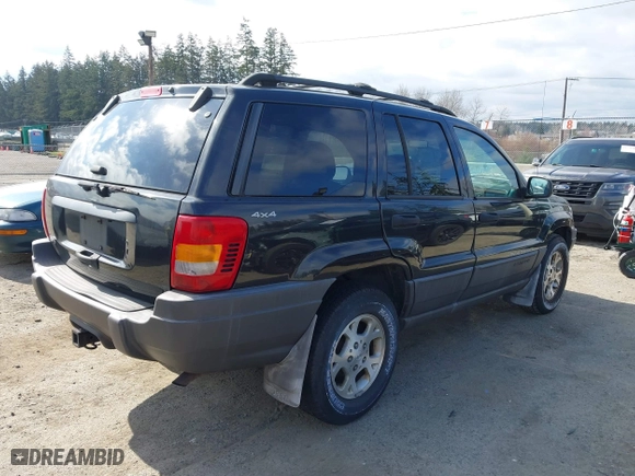 1999 Jeep Grand Cherokee Laredo with VIN 1J4GW58S6XC524451, listed as a IAAI auction lot 41741007 with 162,441 mi miles. Bid and sale history available at carsss.com. Image 4.