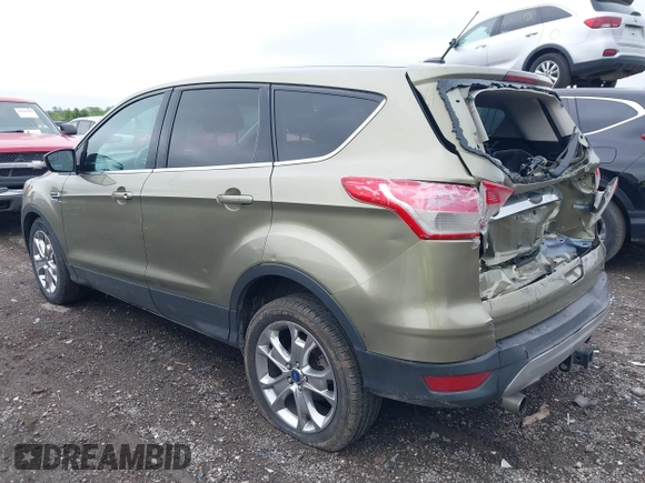 2013 Ford Escape SEL with VIN 1FMCU9H9XDUB61880, listed as a IAAI auction lot 42271136 with 115,837 mi miles and . Bid and sale history available at DreamBid. Image 3.