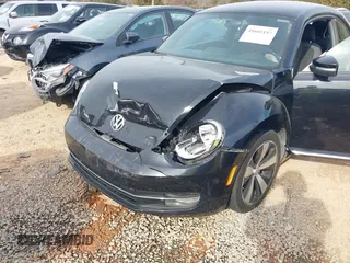 2012 Volkswagen Beetle 2.0T Turbo w/Sun/Snd/Nav PZEV with VIN 3VWVA7AT4CM655068, listed as a IAAI auction lot 41605197 with 115,546 mi miles. Bid and sale history available at carsss.com. Image 6.