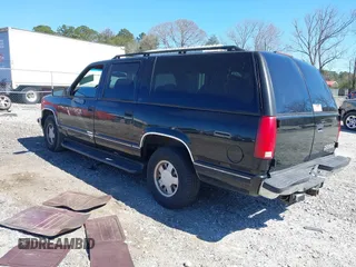 1999 Chevrolet Suburban with VIN 3GNEC16R0XG137834, listed as a IAAI auction lot 41853492 with 296,147 mi miles. Bid and sale history available at carsss.com. Image 3.