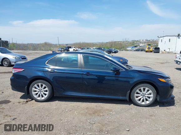 2019 Toyota Camry LE with VIN 4T1B11HK6KU276644, listed as a IAAI auction lot 42037249 with 23,677 mi miles and . Bid and sale history available at DreamBid. Image 13.
