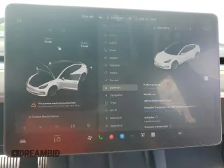 2021 Tesla Model 3 Standard Range Plus z VIN 5YJ3E1EA1MF064335, wystawiony jako Copart lot #57133955 z przebiegiem 60 024 mil mil oraz Szkody całkowita. Historia ofert i sprzedaży dostępna na DreamBid. Obrazek 9.