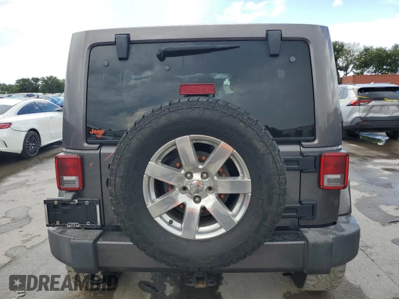 2016 Jeep Wrangler Unlimited 75th Anniversary with VIN 1C4BJWEG3GL216156, listed as a Copart auction lot 62611845 with 87,353 mi miles and Salvage title. Bid and sale history available at DreamBid. Image 6.