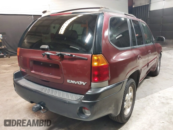 2002 GMC Envoy SLT with VIN 1GKDT13SX22426320, listed as a IAAI auction lot 41709359 with 104,418 mi miles. Bid and sale history available at carsss.com. Image 4.