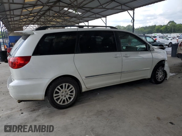 2010 Toyota Sienna XLE with VIN 5TDYK4CCXAS335064, listed as a Copart auction lot 62649665 with 246,327 mi miles and Salvage title. Bid and sale history available at DreamBid. Image 3.