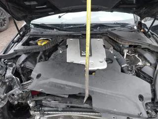 2015 Infiniti Q50 with VIN JN1BV7AR4FM408098, listed as a IAAI auction lot 41571076 with 169,422 mi miles. Bid and sale history available at carsss.com. Image 10.