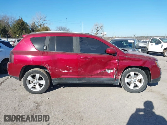 2016 Jeep Compass Latitude with VIN 1C4NJDEB1GD662807, listed as a IAAI auction lot 41161996 with 128,030 mi miles. Bid and sale history available at carsss.com. Image 12.