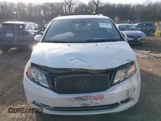 2014 Honda Odyssey Touring with VIN 5FNRL5H97EB037358, listed as a IAAI auction lot 41832825 with 208,894 mi miles and . Bid and sale history available at DreamBid. Image 12.
