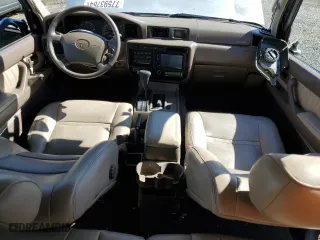 1996 Toyota Land Cruiser with VIN JT3HJ85J0T0145838, listed as a Copart auction lot 77593764 with 158,507 mi miles and Salvage Title. Bid and sale history available at carsss.com. Image 8.