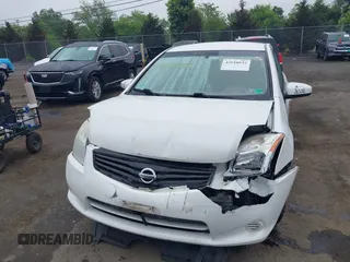 2012 Nissan Sentra S z VIN 3N1AB6APXCL636612, wystawiony jako IAAI lot #42610932 z przebiegiem 150 605 mil mil oraz . Historia ofert i sprzedaży dostępna na DreamBid. Obrazek 12.
