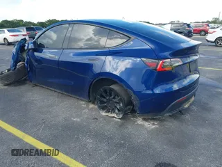 2021 Tesla Model Y Standard Range with VIN 5YJYGDED4MF112857, listed as a IAAI auction lot 41134600 with Not Provided miles and . Bid and sale history available at DreamBid. Image 3.