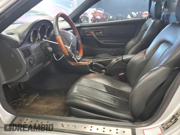 2003 Mercedes-Benz SLK 320 with VIN WDBKK65F83F280656, listed as a Copart auction lot 79158954 with 99,413 mi miles and Salvage title. Bid and sale history available at DreamBid. Image 7.