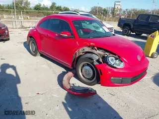 2012 Volkswagen Beetle 2.5L with VIN 3VWJX7AT5CM648739, listed as a IAAI auction lot 41547850 with 214,941 mi miles. Bid and sale history available at carsss.com. Image 1.