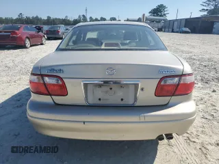 1999 Mazda Millenia z VIN JM1TA2217X1502746, wystawiony jako Copart lot #72165894 z przebiegiem 196 957 mil mil oraz Szkody całkowita. Historia ofert i sprzedaży dostępna na DreamBid. Obrazek 6.