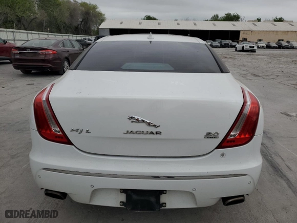 2014 Jaguar XJ with VIN SAJWJ2GD6E8V65987, listed as a Copart auction lot 50091105 with 136,080 mi miles and Clean Title. Bid and sale history available at carsss.com. Image 6.