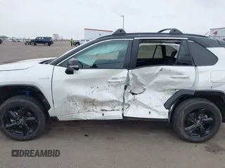 2021 Toyota RAV4 Hybrid XSE with VIN 2T3E6RFV4MW021009, listed as a IAAI auction lot 41940278 with 33,016 mi miles and . Bid and sale history available at DreamBid. Image 14.