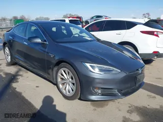 2016 Tesla Model S 90D with VIN 5YJSA1E21GF156453, listed as a IAAI auction lot 41822459 with 41,144 mi miles. Bid and sale history available at carsss.com. Image 1.