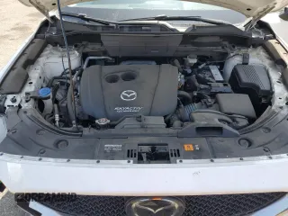 2018 Mazda CX-5 Grand Touring z VIN JM3KFADM3J1464073, wystawiony jako Copart lot #59571385 z przebiegiem Nie podano mil oraz Szkoda całkowita • Salvage title. Historia ofert i sprzedaży dostępna na DreamBid. Obrazek 12.