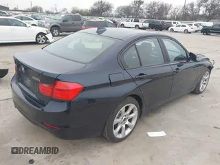 2015 BMW 3 Series 328i xDrive with VIN WBA3B3C54FJ984107, listed as a IAAI auction lot 41565829 with 98,557 mi miles and . Bid and sale history available at DreamBid. Image 4.