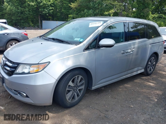 2014 Honda Odyssey Touring with VIN 5FNRL5H97EB054158, listed as a IAAI auction lot 42548360 with 91,161 mi miles and . Bid and sale history available at DreamBid. Image 18.