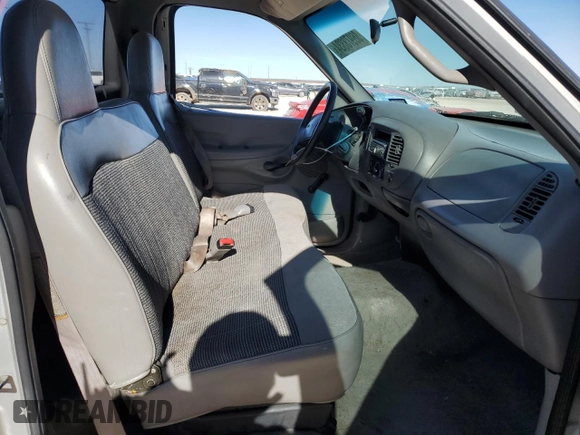 1998 Ford F-150 z VIN 1FTZF1762WKA87421, wystawiony jako Copart lot #86973334 z przebiegiem 217 978 mil mil oraz Szkoda całkowita • Salvage title. Historia ofert i sprzedaży dostępna na DreamBid. Obrazek 7.