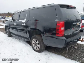 2010 Chevrolet Suburban LS with VIN 1GNUKHE37AR203811, listed as a IAAI auction lot 41304431 with 999,999 mi miles. Bid and sale history available at carsss.com. Image 3.