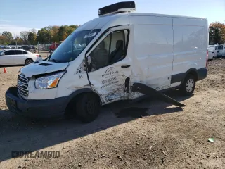 2018 Ford Transit z VIN 1FTYR2CMXJKA73854, wystawiony jako Copart lot #81051414 z przebiegiem Nie podano mil oraz Szkody całkowita. Historia ofert i sprzedaży dostępna na DreamBid. Obrazek 1.