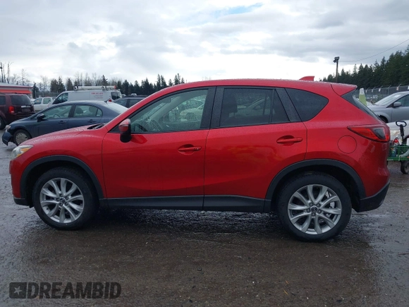2015 Mazda CX-5 Grand Touring with VIN JM3KE4DY0F0479392, listed as a IAAI auction lot 41659415 with 141,403 mi miles. Bid and sale history available at carsss.com. Image 14.
