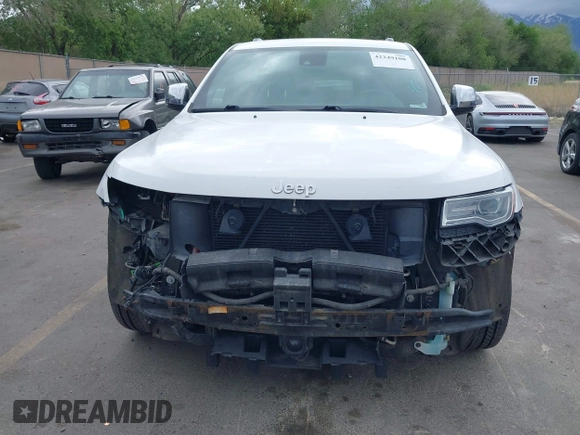 2014 Jeep Grand Cherokee Summit z VIN 1C4RJFJG2EC476114, wystawiony jako IAAI lot #42249108 z przebiegiem 97 569 mil mil oraz . Historia ofert i sprzedaży dostępna na DreamBid. Obrazek 6.