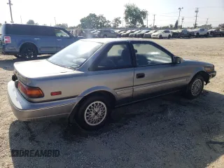 1990 Toyota Corolla z VIN JT2AE96J0L3382052, wystawiony jako Copart lot #57894754 z przebiegiem 90 550 mil mil oraz Czysty tytuł • Clean title. Historia ofert i sprzedaży dostępna na DreamBid. Obrazek 3.