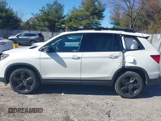 2019 Honda Passport Elite z VIN 5FNYF8H04KB005307, wystawiony jako IAAI lot #41828725 z przebiegiem 61 864 mil mil oraz . Historia ofert i sprzedaży dostępna na DreamBid. Obrazek 14.