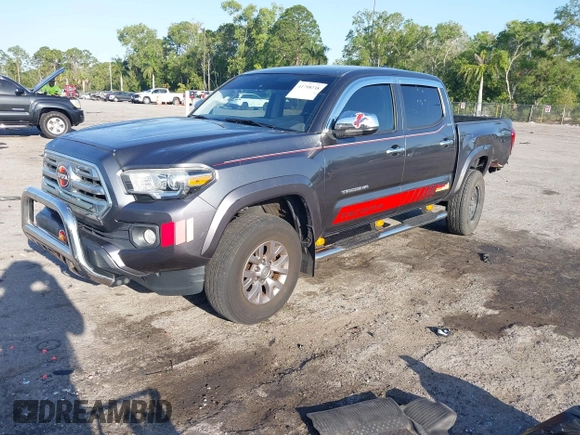2018 Toyota Tacoma SR5 with VIN 3TMAZ5CN4JM069965, listed as a IAAI auction lot 41798238 with 124,619 mi miles and . Bid and sale history available at DreamBid. Image 2.