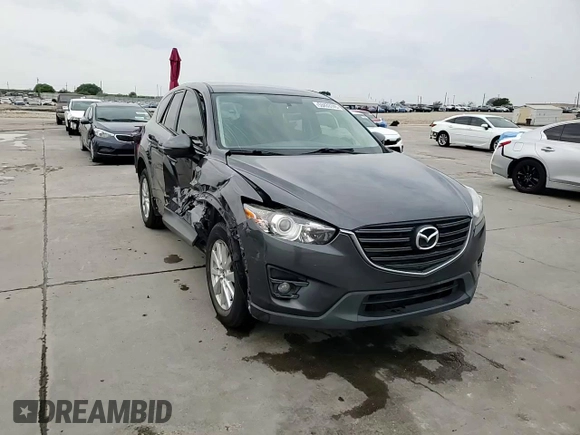 2016 Mazda CX-5 Touring z VIN JM3KE2CY7G0654292, wystawiony jako Copart lot #53433745 z przebiegiem 168 273 mil mil oraz Szkoda całkowita • Salvage title. Historia ofert i sprzedaży dostępna na DreamBid. Obrazek 14.