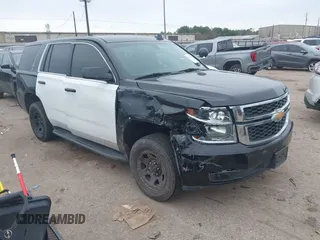 2018 Chevrolet Tahoe Commercial z VIN 1GNLCDEC1JR312458, wystawiony jako IAAI lot #41371563 z przebiegiem 114 086 mil mil oraz . Historia ofert i sprzedaży dostępna na DreamBid. Obrazek 1.