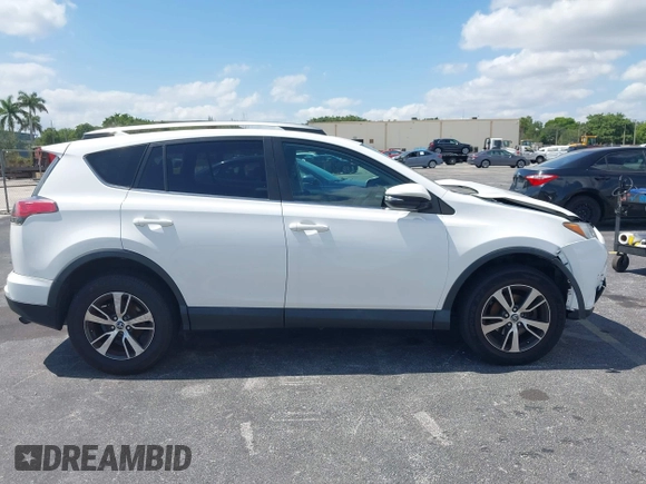 2018 Toyota RAV4 XLE with VIN 2T3WFREV9JW490324, listed as a IAAI auction lot 42298261 with 167,727 mi miles and . Bid and sale history available at DreamBid. Image 13.