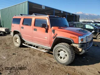 2003 Hummer H2 with VIN 5GRGN23U33H125797, listed as a Copart auction lot 77170554 with 166,739 mi miles and Clean Title. Bid and sale history available at carsss.com. Image 4.