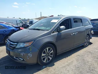 2014 Honda Odyssey Touring with VIN 5FNRL5H90EB082691, listed as a IAAI auction lot 42572977 with 54,413 mi miles and . Bid and sale history available at DreamBid. Image 17.