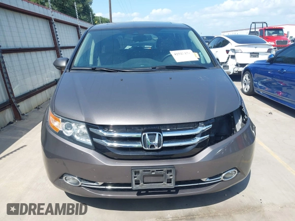 2014 Honda Odyssey Touring with VIN 5FNRL5H99EB075979, listed as a IAAI auction lot 42520154 with 99,314 mi miles and . Bid and sale history available at DreamBid. Image 13.