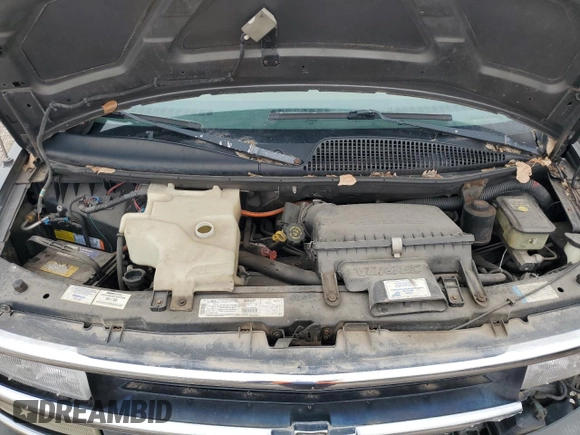 1999 Chevrolet Express z VIN 1GBFG15R9X1089305, wystawiony jako Copart lot #51810075 z przebiegiem 130 441 mil mil oraz Szkoda całkowita • Salvage title. Historia ofert i sprzedaży dostępna na DreamBid. Obrazek 12.