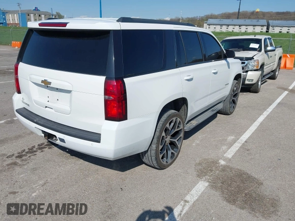 2015 Chevrolet Tahoe LT with VIN 1GNSCBKCXFR552071, listed as a IAAI auction lot 41972157 with 214,738 mi miles and . Bid and sale history available at DreamBid. Image 4.