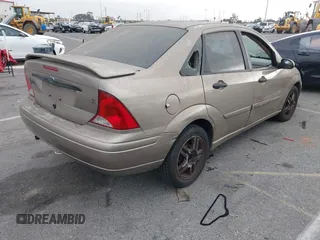 2003 Ford Focus SE z VIN 1FAFP34Z73W236474, wystawiony jako IAAI lot #39378102 z przebiegiem 183 280 mil mil oraz . Historia ofert i sprzedaży dostępna na DreamBid. Obrazek 4.