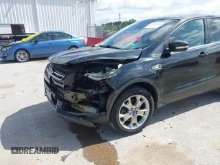 2013 Ford Escape SEL with VIN 1FMCU9HX1DUB97939, listed as a IAAI auction lot 42293561 with 196,951 mi miles and . Bid and sale history available at DreamBid. Image 6.