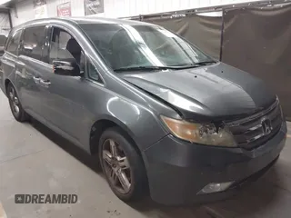 2012 Honda Odyssey Touring с VIN 5FNRL5H99CB047340, выставлен на аукционе IAAI как лот 41965189 с пробегом Не указан миль и . История ставок и продаж доступна на DreamBid. Изображение 1.