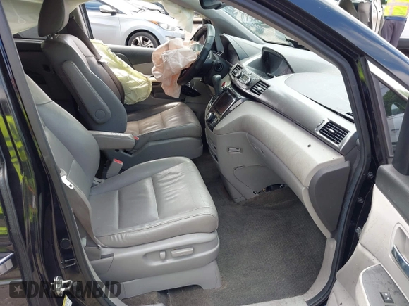 2014 Honda Odyssey Touring with VIN 5FNRL5H94EB057499, listed as a IAAI auction lot 41983956 with 158,573 mi miles and . Bid and sale history available at DreamBid. Image 5.