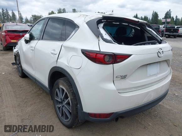 2018 Mazda CX-5 Grand Touring with VIN JM3KFBDM1J0382306, listed as a IAAI auction lot 42554947 with 121,303 mi miles and . Bid and sale history available at DreamBid. Image 3.