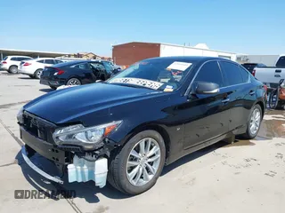 2015 Infiniti Q50 Premium with VIN JN1BV7AP9FM355526, listed as a IAAI auction lot 42010401 with 67,131 mi miles. Bid and sale history available at carsss.com. Image 2.