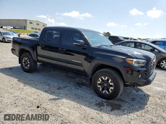 2023 Toyota Tacoma SR with VIN 3TMCZ5AN3PM571922, listed as a Copart auction lot 61872775 with 34,501 mi miles and Salvage title. Bid and sale history available at DreamBid. Image 4.