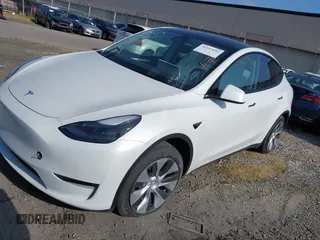 2024 Tesla Model Y with VIN 7SAYGDED2RF017448, listed as a IAAI auction lot 41597056 with 9,702 mi miles and . Bid and sale history available at DreamBid. Image 24.
